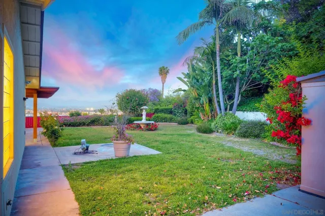 a view of a backyard with sitting area and furniture