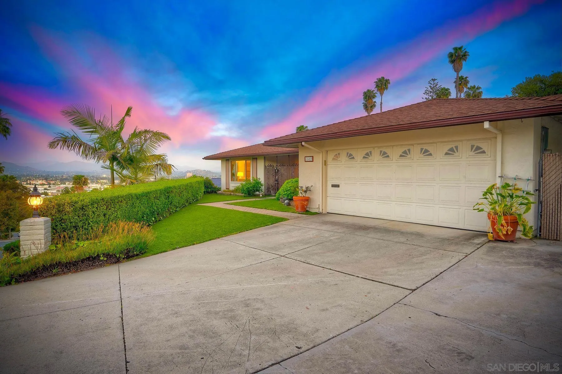 1605 Swallow Drive El Cajon, CA 92020 - Photo 33 of 39 a view of a house with a yard and potted plants