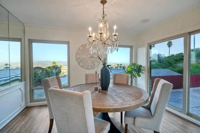 a view of a dining room with furniture window and wooden floor