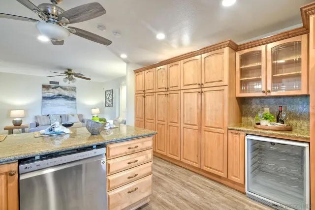 a kitchen with stainless steel appliances granite countertop a stove microwave and refrigerator