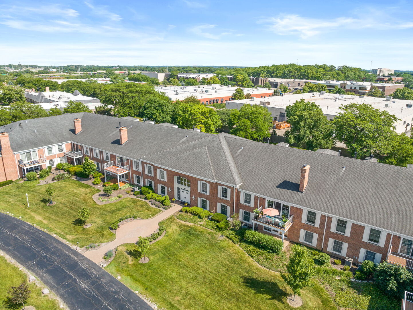 124 Carriage Way Drive, Unit B109 Burr Ridge, IL 60527 - Photo 24 of 31 a view of a city from a terrace