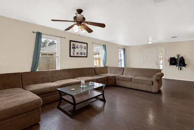 a living room with furniture and a large window