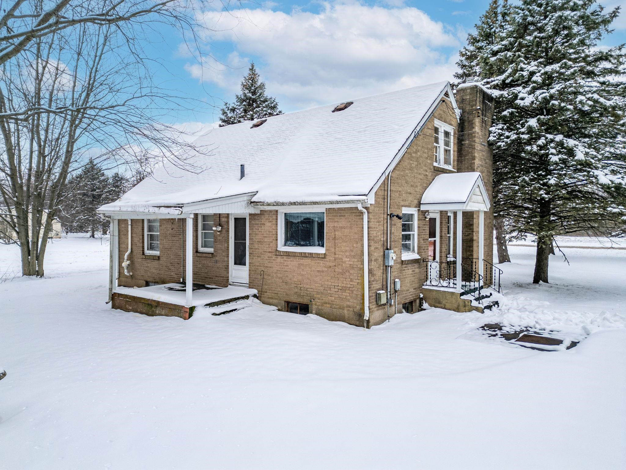 3606 Prairie Road Rockford, IL 61102 - Photo 17 of 28 a view of a house with a yard and large trees