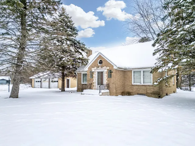 a view of a house with a snow in the yard