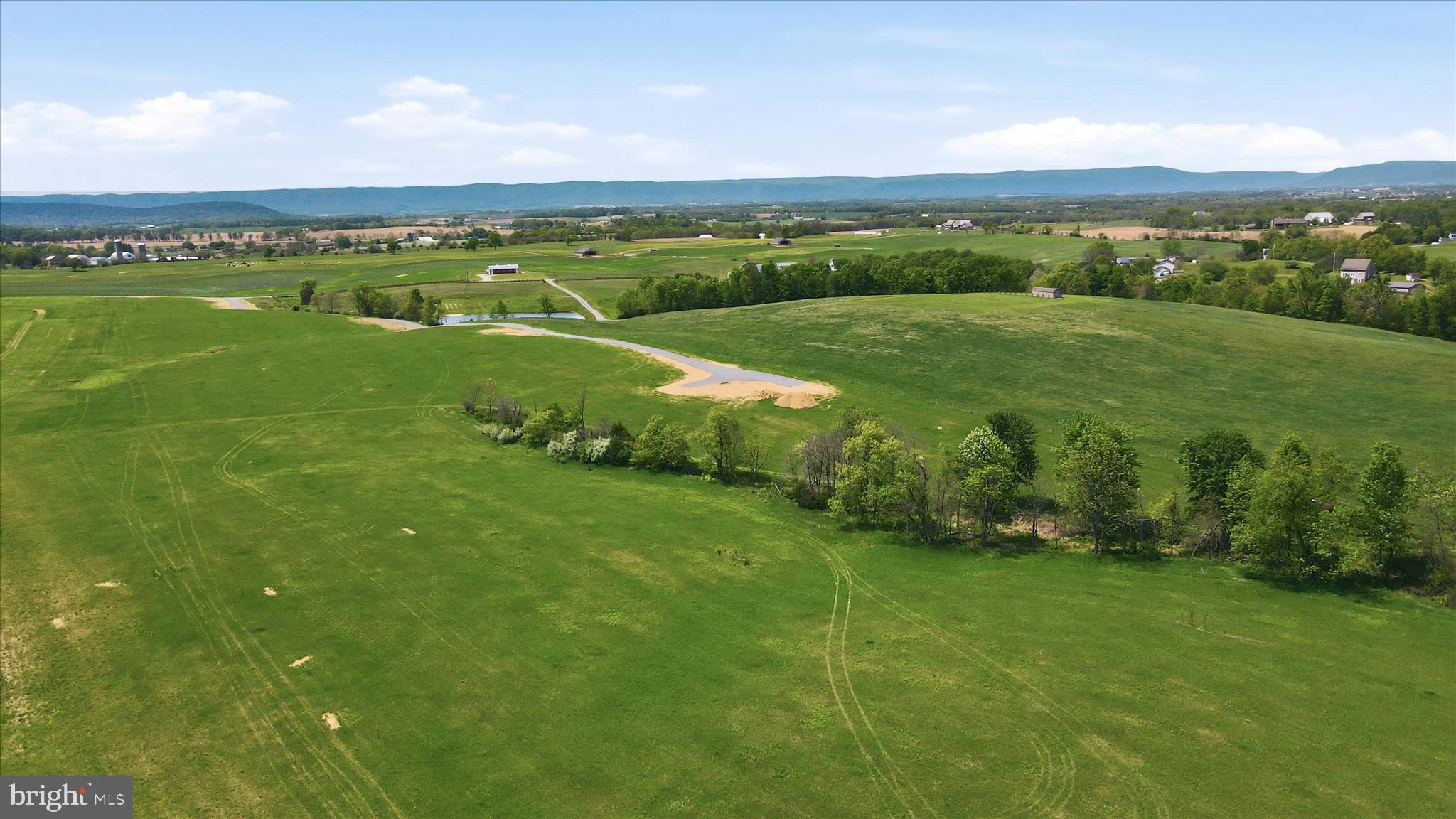 6502 Bino Road, Unit LOT 2 Greencastle, PA 17225 - Photo 6 of 12 a view of a city with lush green forest