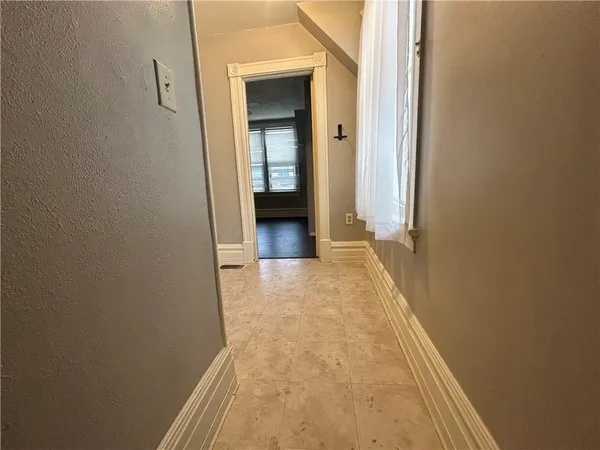 a bathroom with a sink toilet and a mirror