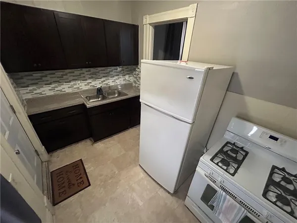 a view of kitchen and utility room