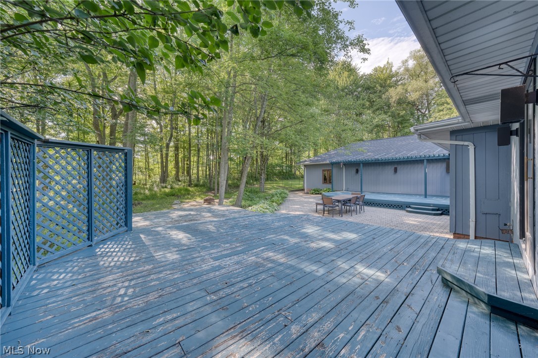 4830 Som Center Road Moreland Hills, OH 44022 - Photo 42 of 48 A private retreat just steps from the primary suite: this secluded deck offers a quiet spot for morning coffee or starlit evenings, your own slice of calm tucked away from it all.