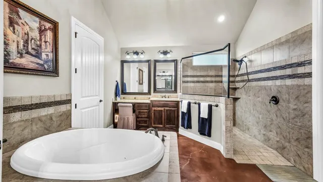 a bedroom with furniture and a large window