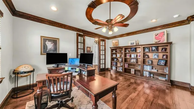a view of a livingroom with furniture window and wooden floor