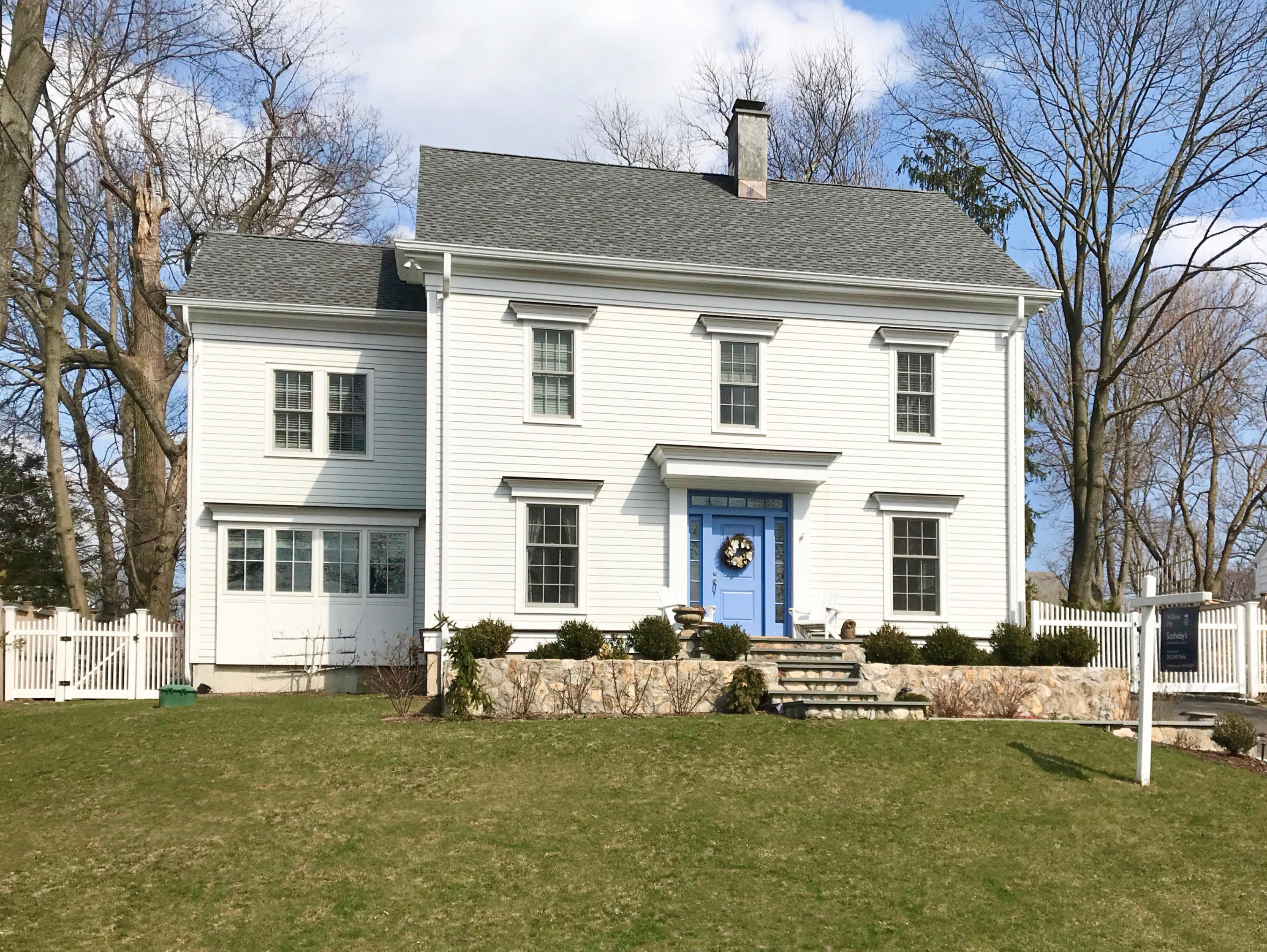 34 Walmsley Road Darien, CT 06820 - Photo 1 of 29 a front view of a house with a garden and trees