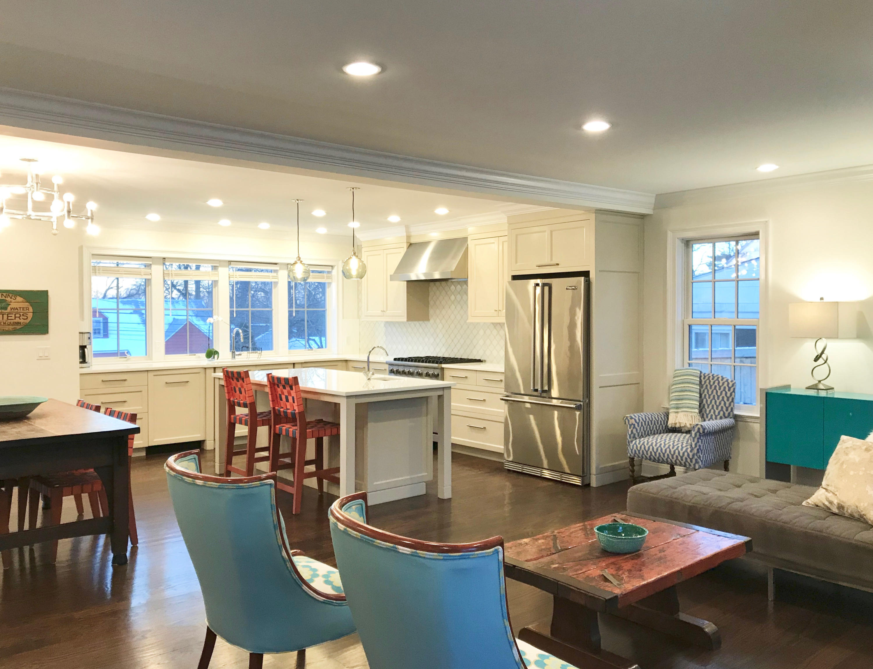 34 Walmsley Road Darien, CT 06820 - Photo 6 of 29 a kitchen with stainless steel appliances granite countertop a stove a refrigerator a kitchen island a table and chairs in it