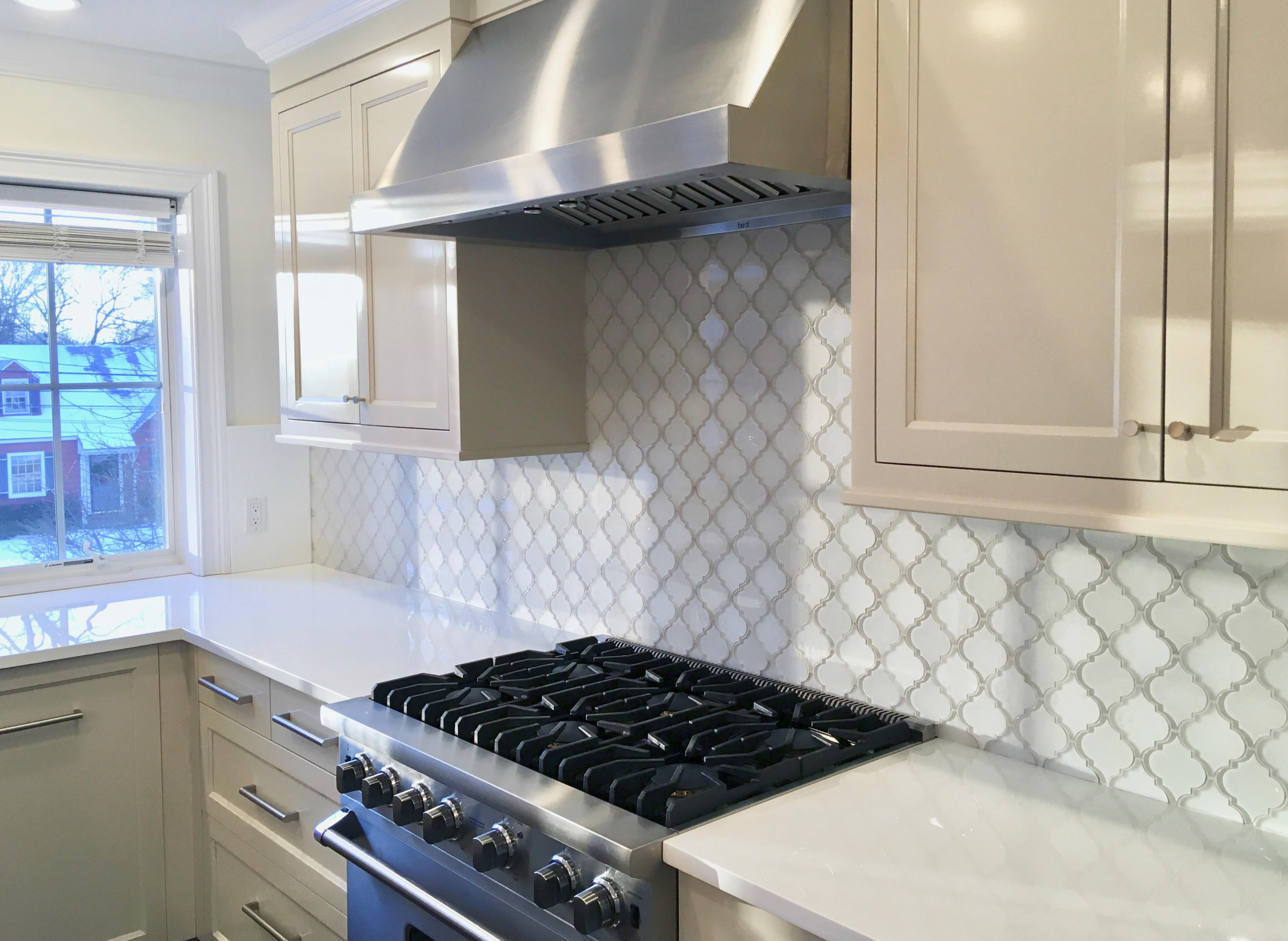 34 Walmsley Road Darien, CT 06820 - Photo 8 of 29 a kitchen with a stove and a white cabinet