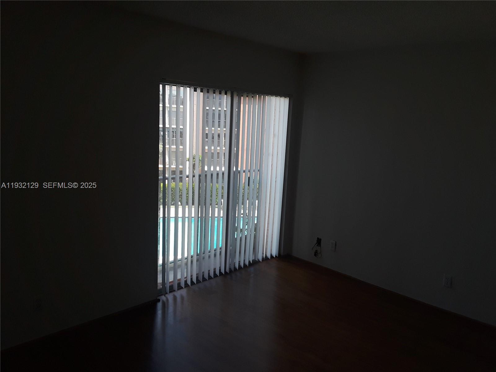 8700 Sherman Circle North, Unit 407 Miramar, FL 33025 - Photo 11 of 12 a view of wooden floor and windows