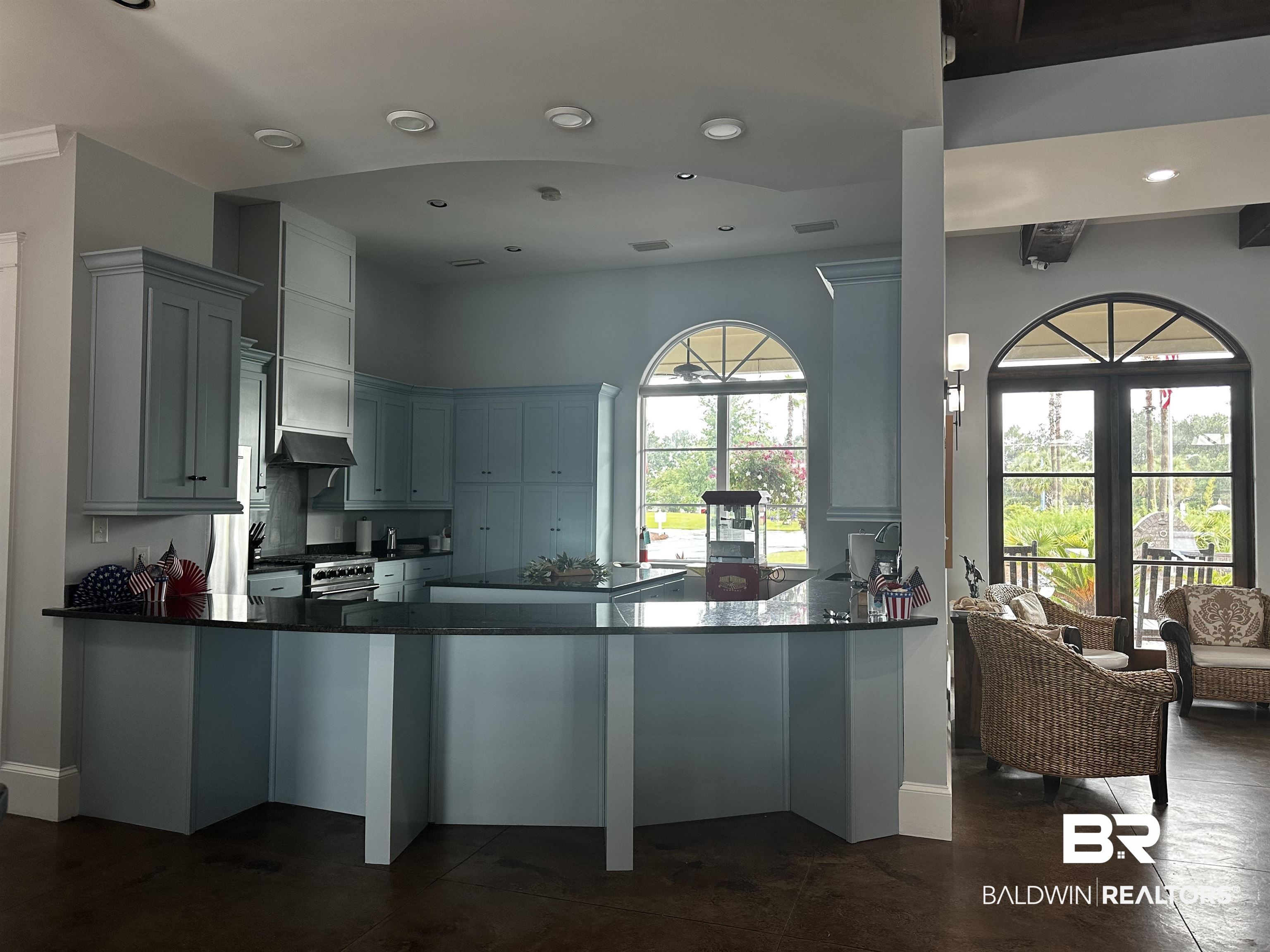 28085 Migratory Way Elberta, AL 36530 - Photo 16 of 59 Kitchen with a peninsula, dark countertops, gas stove, and recessed lighting