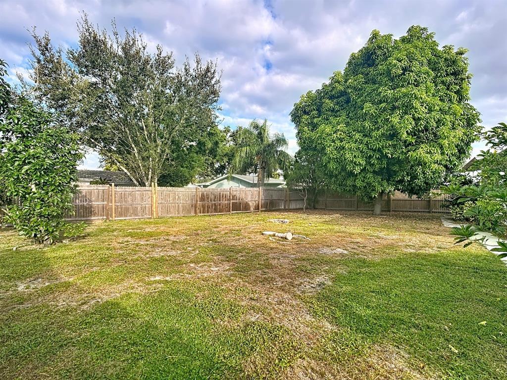 11320 Currie Lane Largo, FL 33774 - Photo 39 of 40 a view of a swimming pool with an outdoor space and seating area