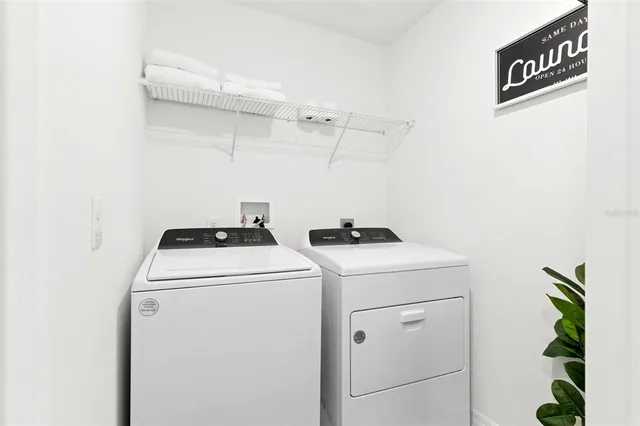 a utility room with dryer and washer