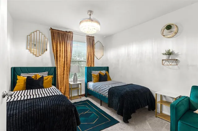 a bedroom with bed and a window