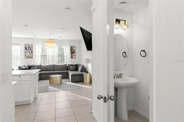 a spacious bathroom with a toilet sink and mirror