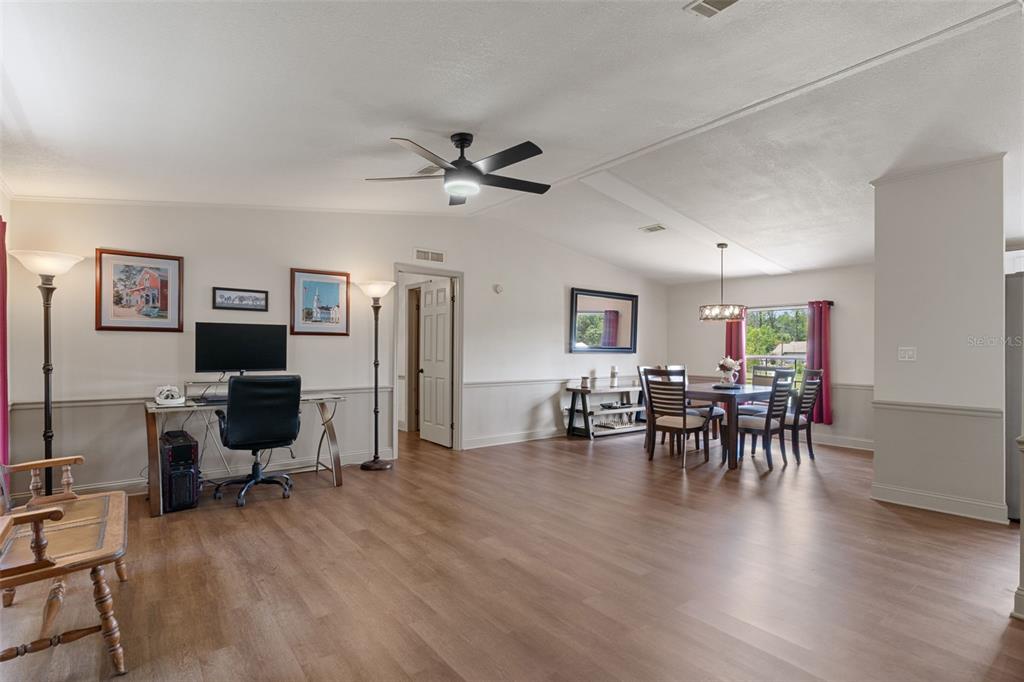 26255 Lambeth Road Brooksville, FL 34601 - Photo 11 of 76 a view of a livingroom with furniture and a flat screen tv