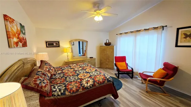 a bed room with a bed and furniture