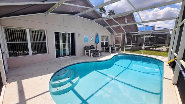 a view of a swimming pool with a patio