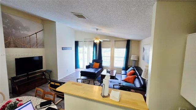 a view of a workspace with furniture and a fireplace