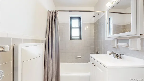 a bathroom with a sink a toilet and a bathtub