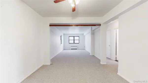 a view of a windows and chandelier in a room
