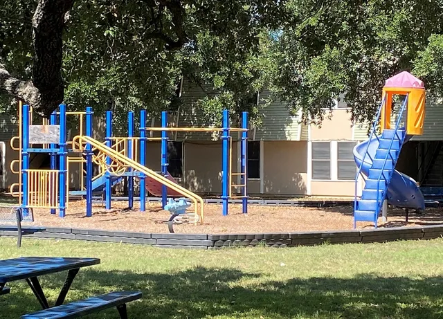 a view of a house with swimming pool and sitting area
