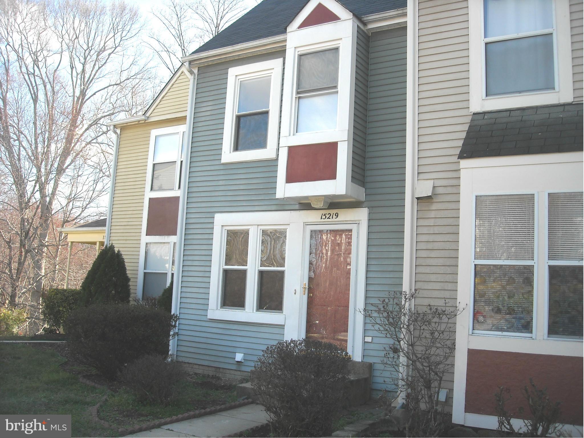 a view of a brick house with a large windows