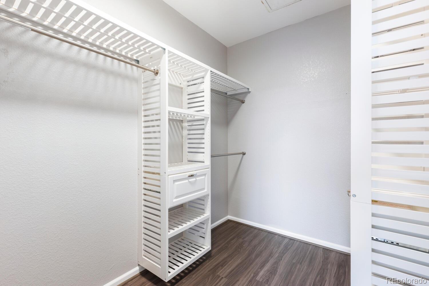 14251 East 1st Drive, Unit 305 Aurora, CO 80011 - Photo 13 of 22 a view of wooden floor in a room