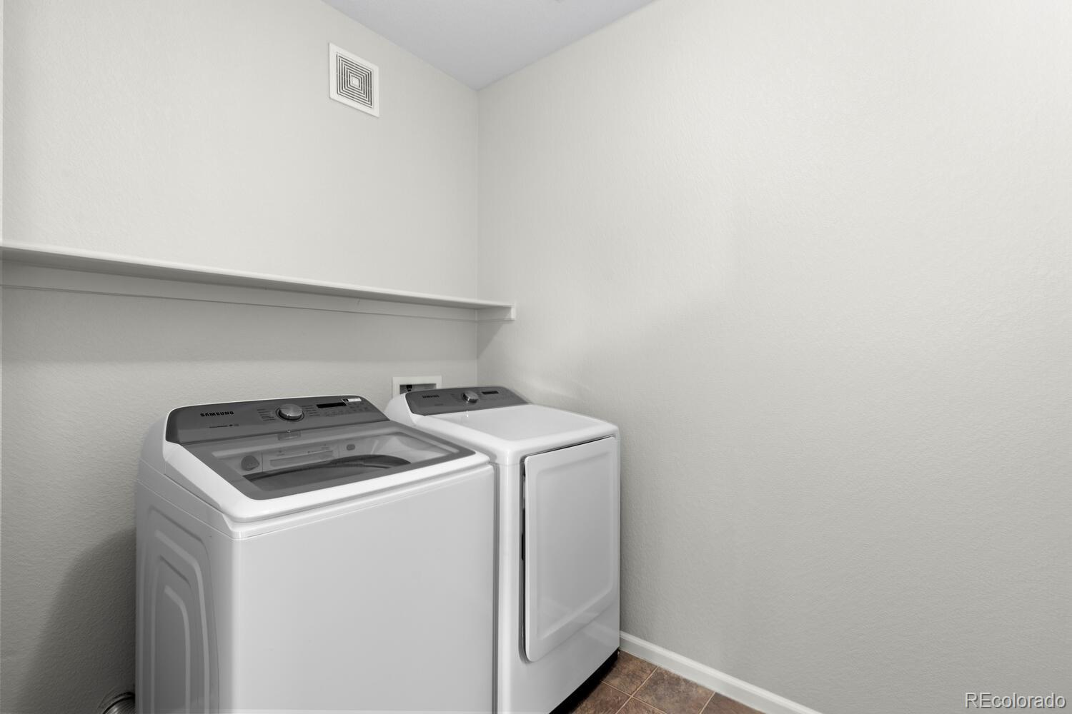 14251 East 1st Drive, Unit 305 Aurora, CO 80011 - Photo 17 of 22 a utility room with dryer and washer