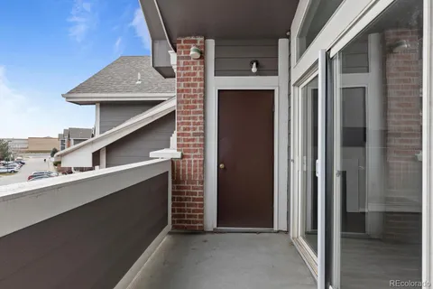 a view of a house with a door and balcony