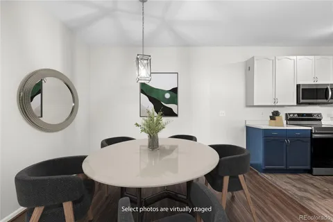 a view of kitchen and dining area with furniture