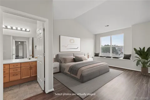 a bedroom with a large bed and a large window