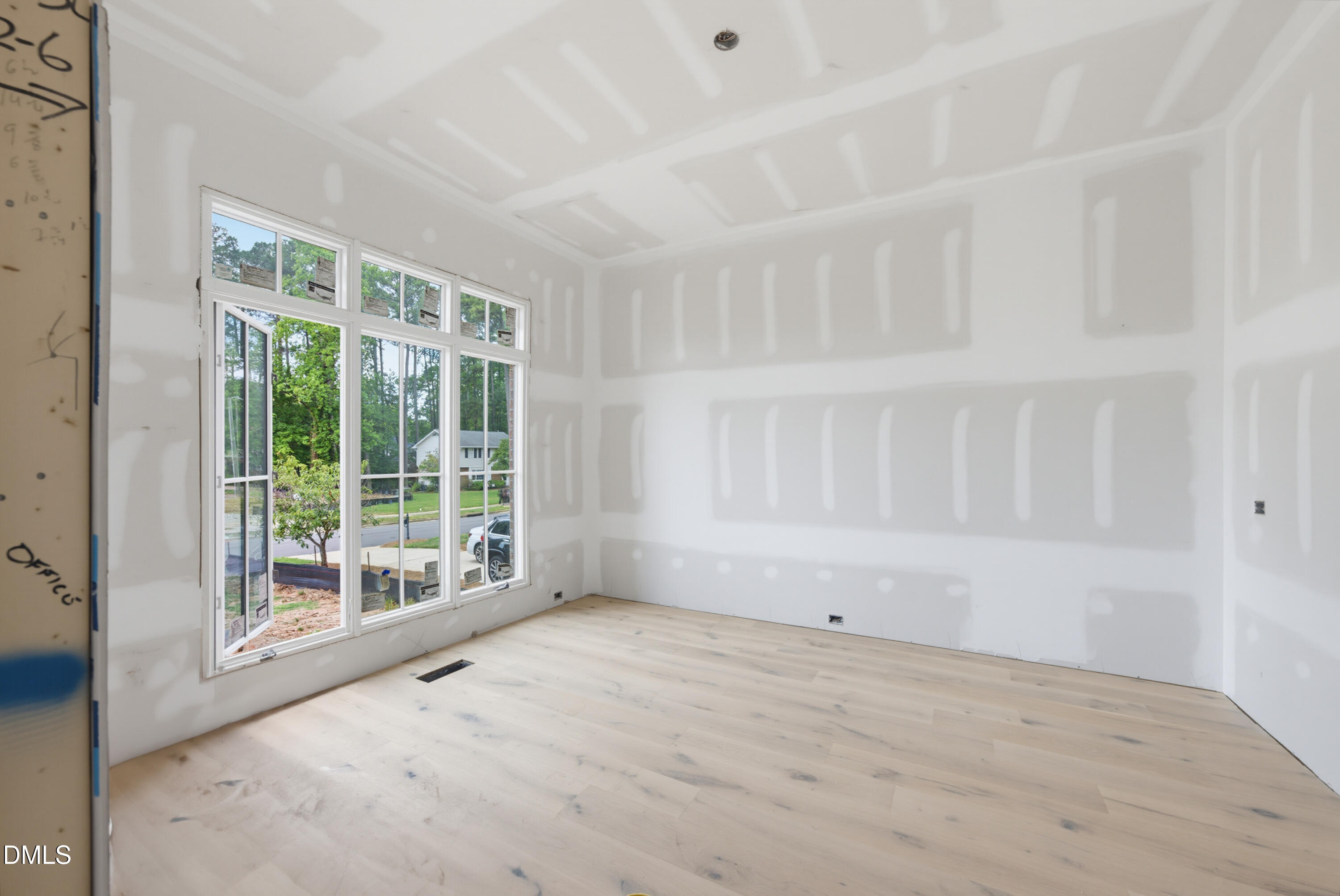 7508 Grist Mill Road Raleigh, NC 27615 - Photo 3 of 32 a view of an empty room with a window