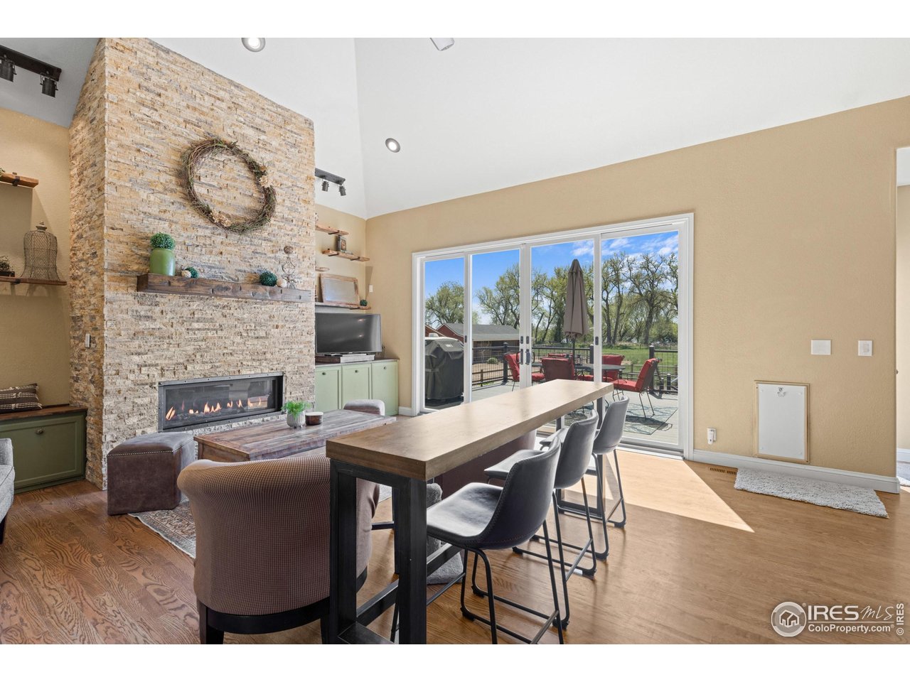 111 Hunter's Cove Road Mead, CO 80542 - Photo 4 of 40 Open living room with beautiful views of the backyard and lake