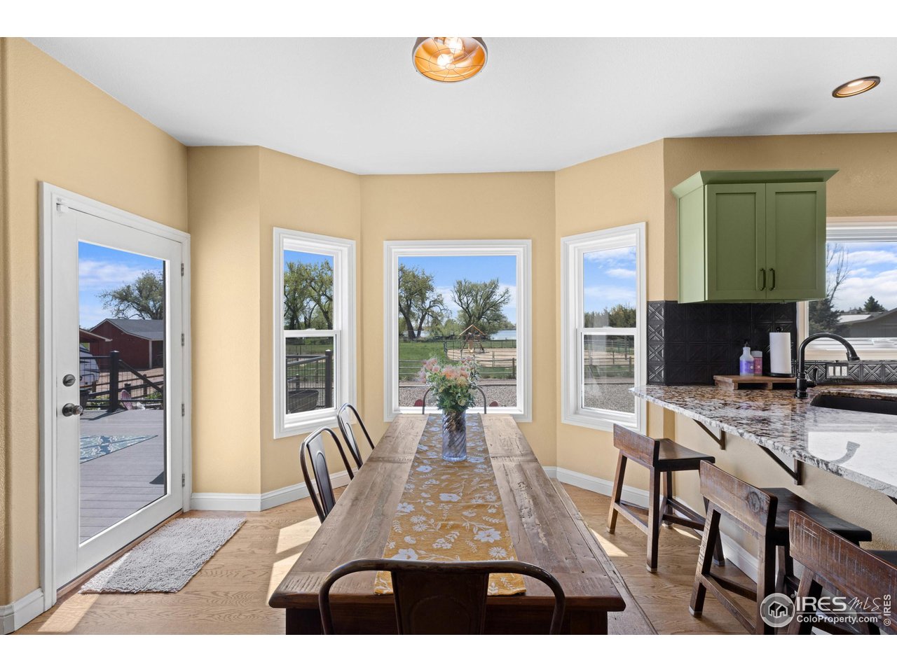 111 Hunter's Cove Road Mead, CO 80542 - Photo 7 of 40 Eat in kitchen with beautiful views of the lake