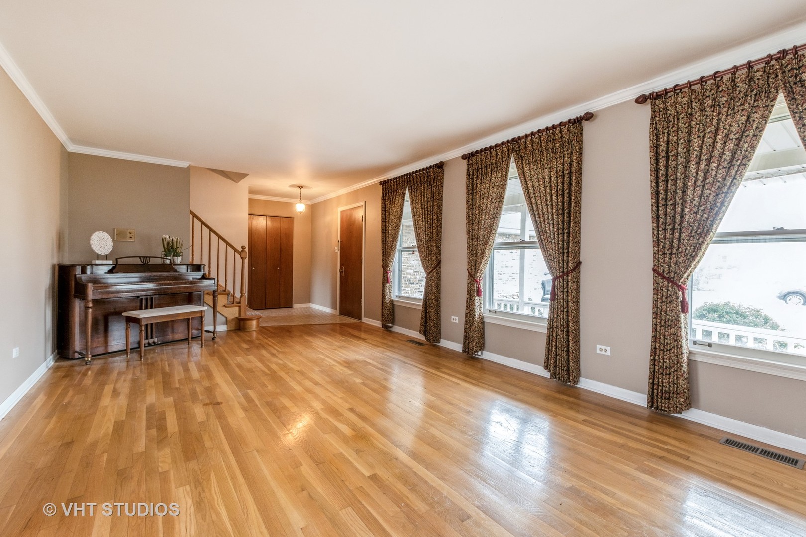 2849 Willow Road Homewood, IL 60430 - Photo 2 of 15 a view of an empty room with wooden floor and a window