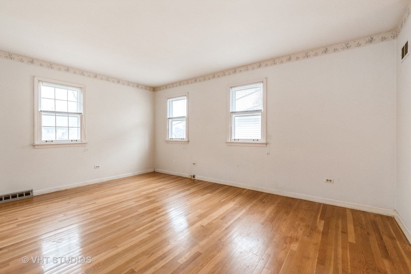 2849 Willow Road Homewood, IL 60430 - Photo 9 of 15 an empty room with wooden floor and windows