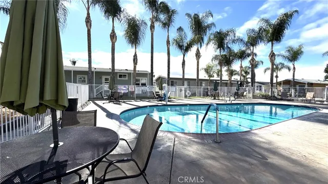 a view of a swimming pool with a patio