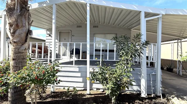 a view of a house with a flower garden