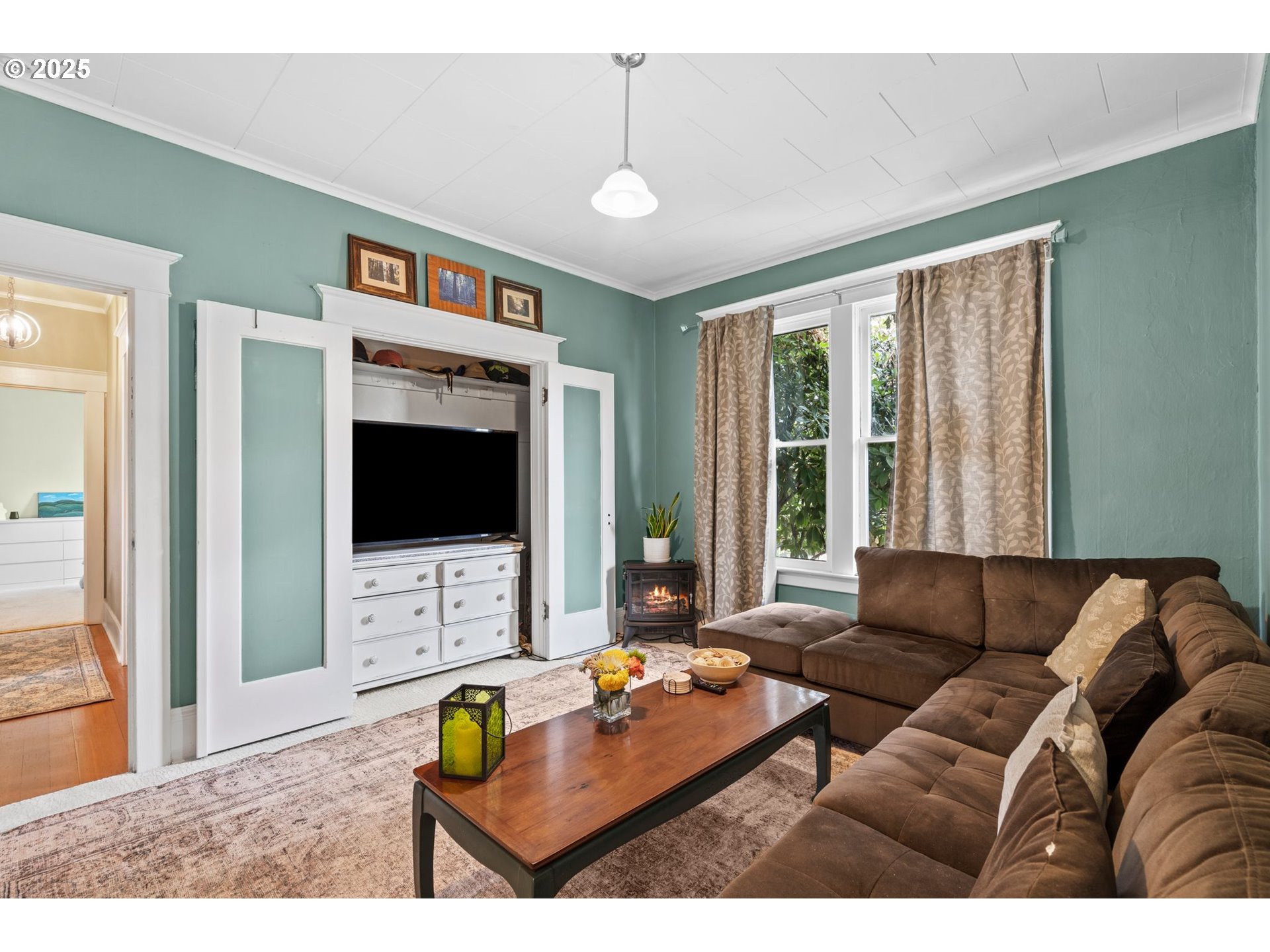 1306 B Street Washougal, WA 98671 - Photo 16 of 32 a living room with furniture and a flat screen tv