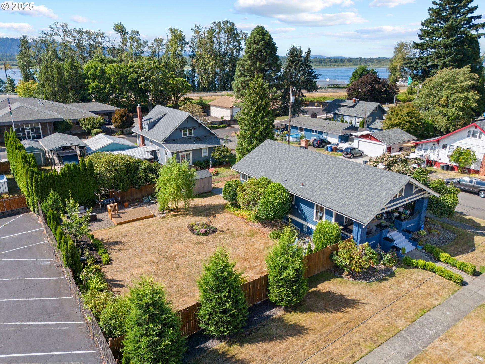 1306 B Street Washougal, WA 98671 - Photo 2 of 32 an aerial view of a house with yard patio and lake view