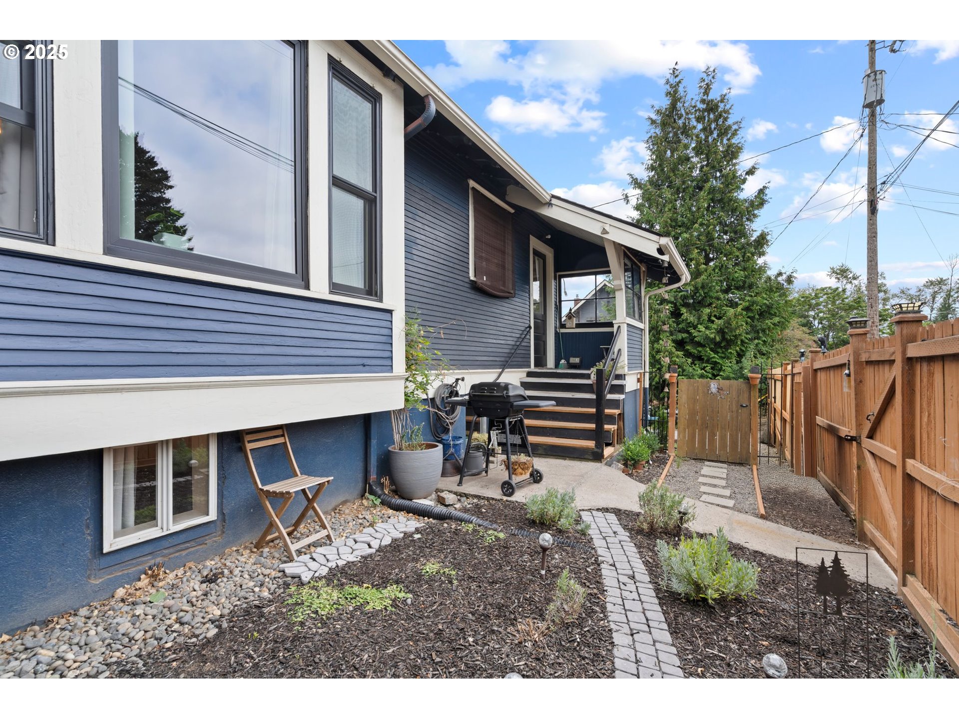 1306 B Street Washougal, WA 98671 - Photo 32 of 32 a backyard of a house with barbeque oven and outdoor seating