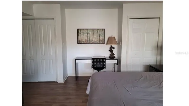 a bed room with a bed and a view of bathroom