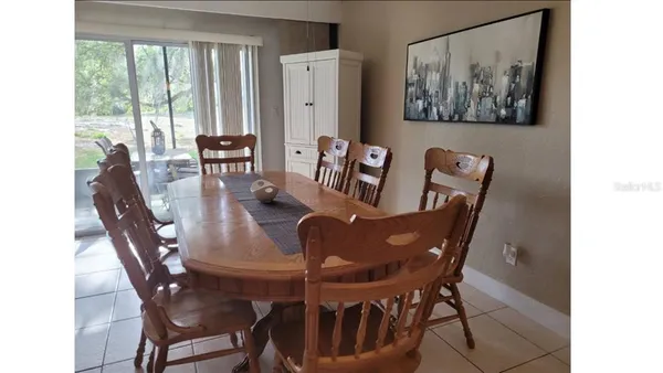 a view of a dining room with furniture window and outside view