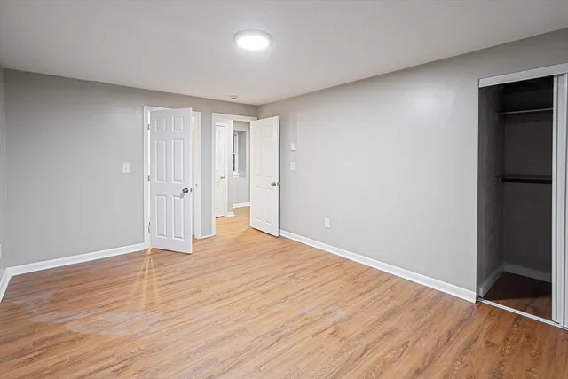 a bathroom with a sink mirror vanity and toilet