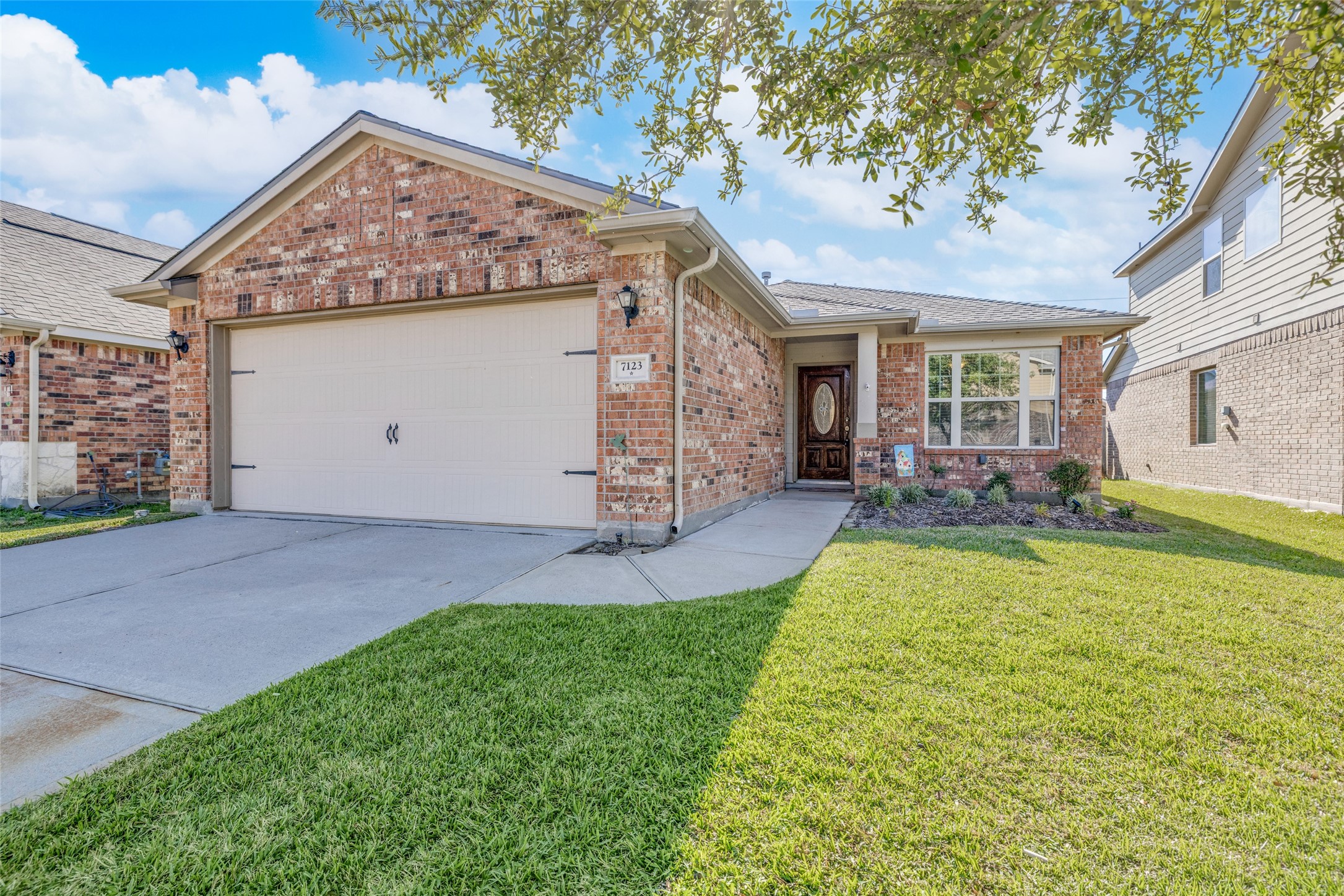7123 Panther Ridge Drive Spring, TX 77389 - Photo 4 of 31 a view of a house with a yard and garage